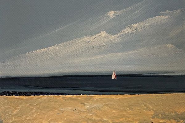 This image depicts a serene beach scene with a sandy shore, a calm sea, and a lone sailboat in the distance under a partly cloudy sky.