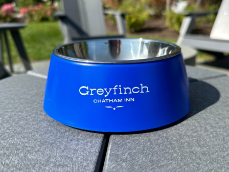 A blue pet bowl with the text 